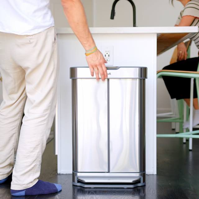 A Pulli Bin being opened and a full bag pulled out through the front doors